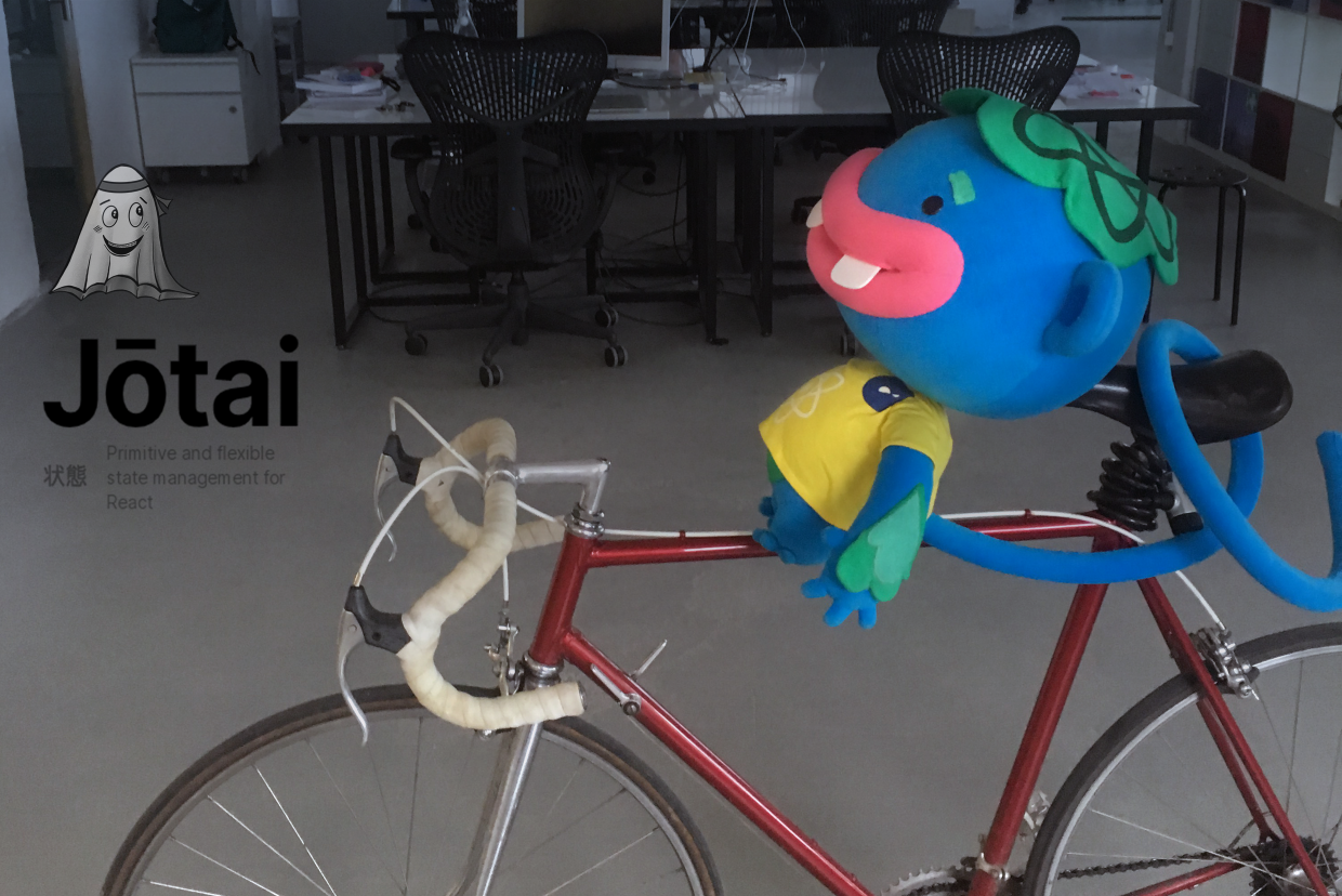The Despark React monkey on a bike with the Jotai logo